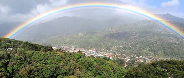 Looking down into the town of Boquete through a rainbow.